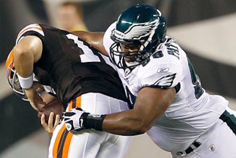 Mike Patterson sacks Browns quarterback Colt McCoy in the first half of Thursday night's game. (Yong Kim/Staff Photographer)