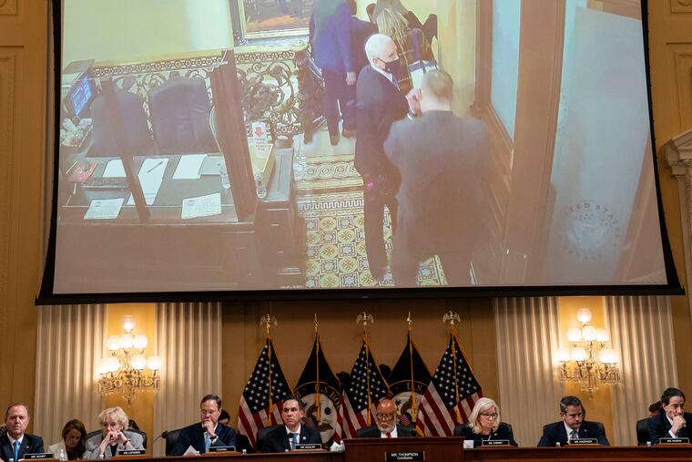 Images of Vice President Mike Pence at the U.S. Capitol during the Jan. 6, 2021, Capitol attack are seen on a video screen behind the House committee investigating the riot.