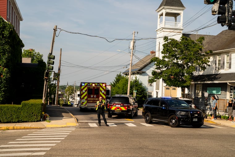 A police officer stands near the site of a shooting involving a federal immigration agent in Biddeford, Maine, on Monday, July 13, 2026. A federal immigration agent shot and killed an individual in a vehicle on Monday morning in the coastal city of Biddeford, Maine, according to the state attorney general’s office.