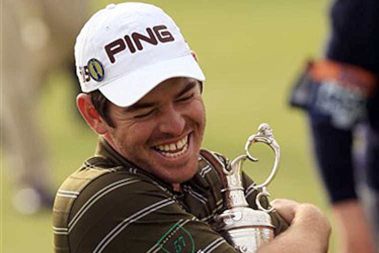 South Africa's Louis Oosthuizen hugs his trophy after winning the British Open. (AP Photo/Jon Super)