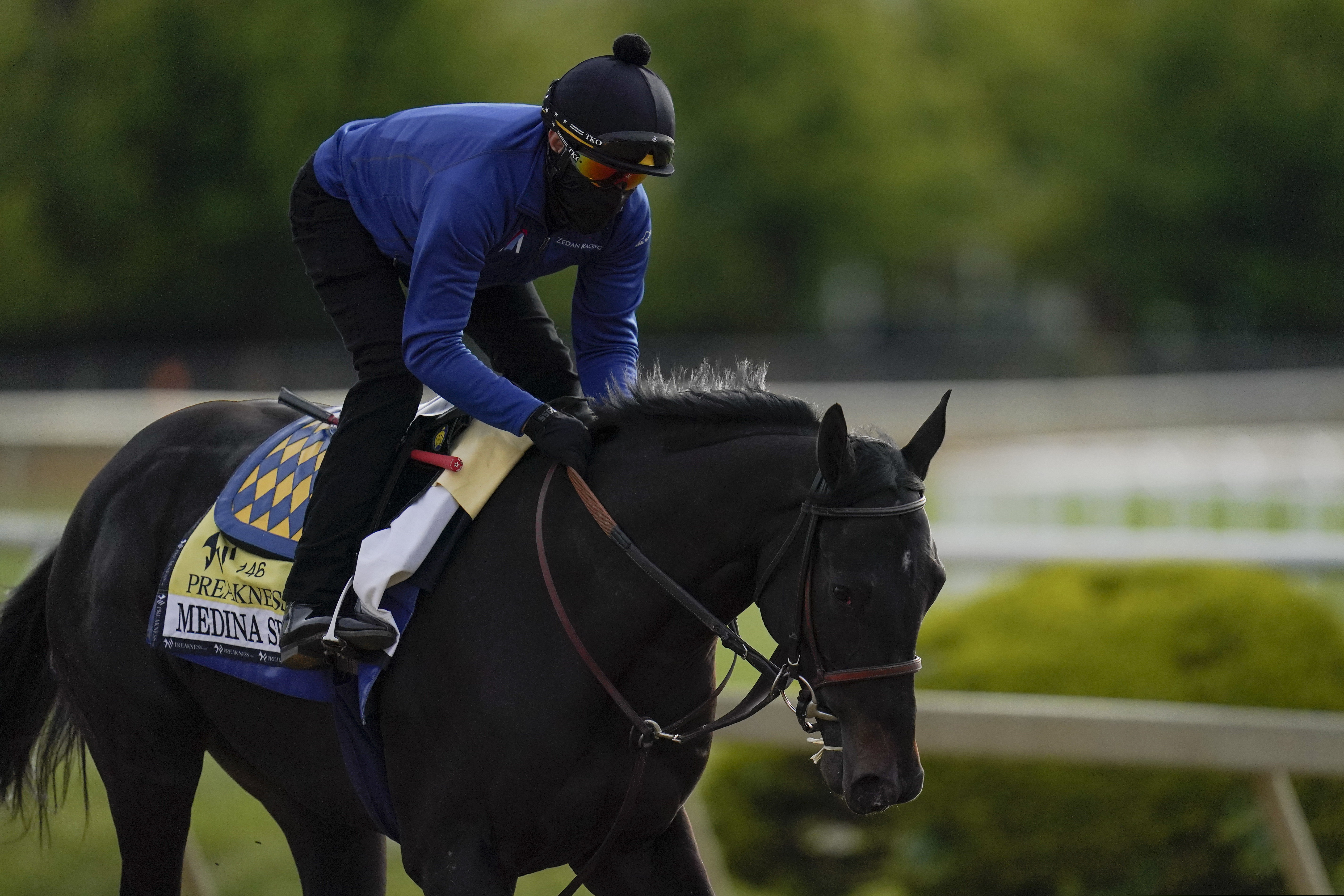 Exercise rider Humberto Gomez took Kentucky Derby winner and Preakness entrant Medina Spirit over the track during a training session Wednesday.