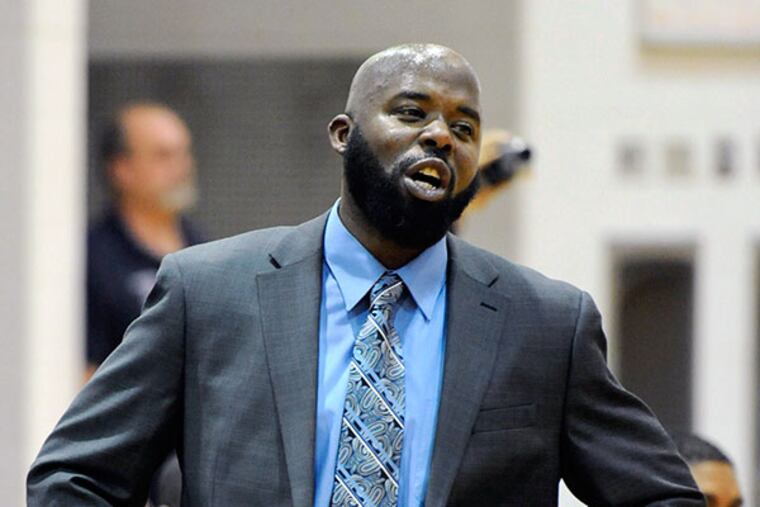 Camden head coach Cetchswayo Byrd tries to get his team going in the second quarter of the game December 16, 2011. ( Ron Tarver / Staff Photography )