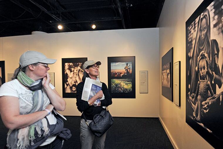 The National Constitution Center is open in spite of the federal shutdown on Oct. 15, 2013. Here, Stephanie Fayolle, left; and Elizabeth Loupi, who were visiting from France. ( APRIL SAUL / Staff )