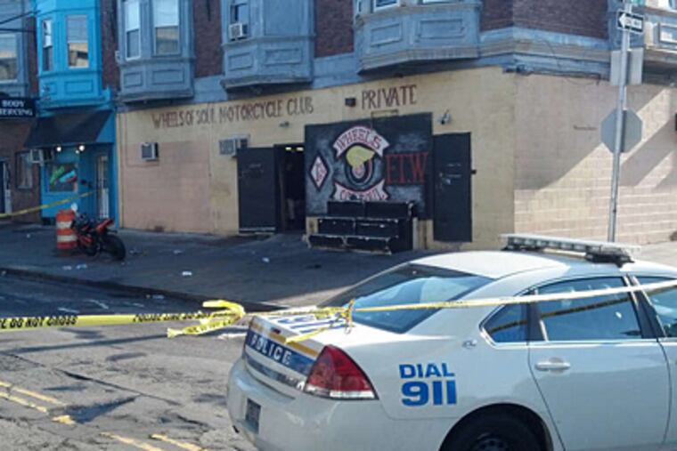 Three men were shot, one fatally, outside the headquarters of Wheels of Soul motorcycle club, in West Philadelphia. (Solomon Leach/Staff)