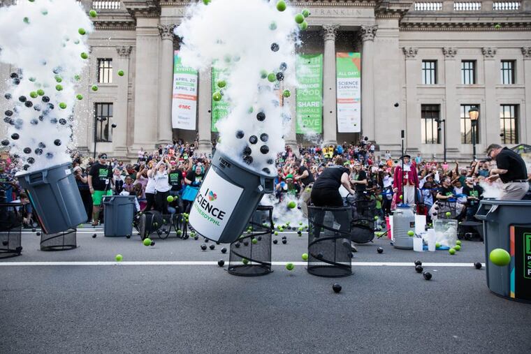 Trash cans fly into the air, full of rubber balls and liquid nitrogen, as part of the "trash can salute," the finale event of the Philadelphia Science Festival on Saturday, April 28, 2018. The "trash can salute" was hosted out front of the Franklin Institute. SYDNEY SCHAEFER / Staff Photographer