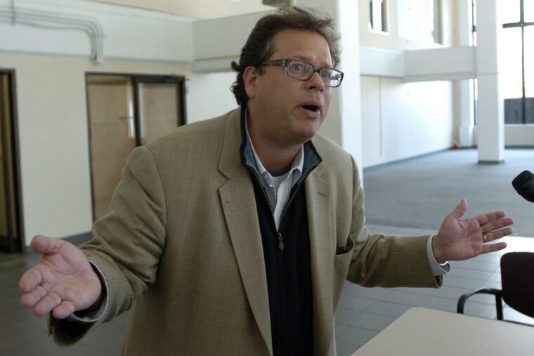 Ken Smukler talks to reporters at the former offices of the Inquirer and Daily News on Friday, May 4, 2007.