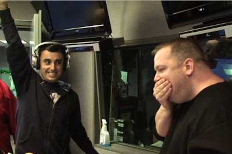 Gluteus Waximus attempts to eat five double cheeseburgers in three minutes during Wing Bowl qualifying Wednesday.