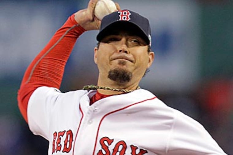 Josh Beckett, acquired from the Red Sox in a nine-player trade, expects to be ready to play for the Dodgers next season. (Elise Amendola/ AP)