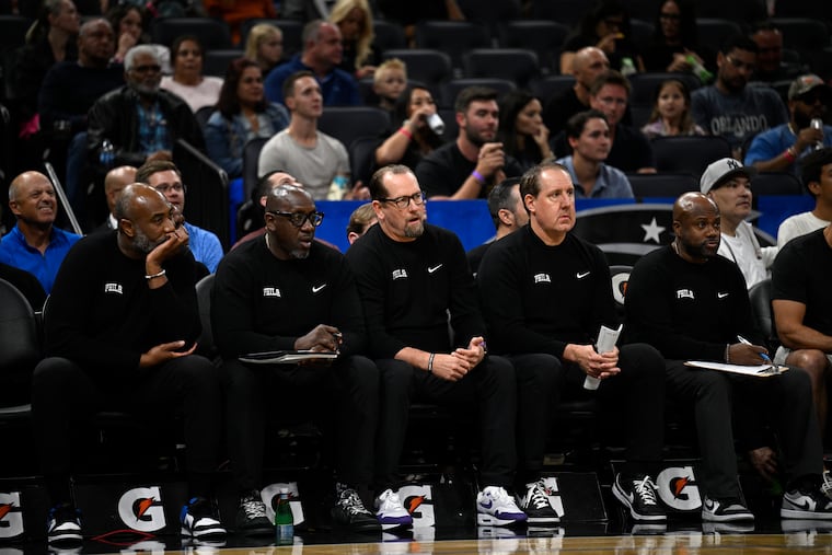 Sixers assistant coach Bobby Jackson (second from left) reportedly is joining the Kings coaching staff.