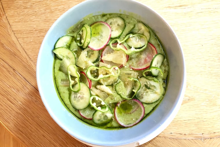 Avocado and zucchini soup at a.kitchen with shaved radishes, cucumbers, spicy Padron peppers at grated black lime.