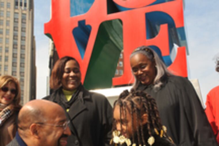 Mayor Nutter thanks Destiny Hill, 7, a first grader at Henry C. Lea Elementary School who introduced him at a news conference in LOVE Park. Behind them are (from left) Girard Estates leader Elaine Fera, city constituent services assistant Vernice Bradley, and Streets Commissioner Clarena Tolson.