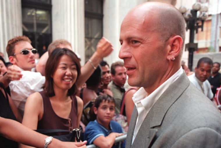 "Sixth Sense" star Bruce Willis greeting fans outside the premiere in 1999 at the Prince Music Theater on Chestnut Street.