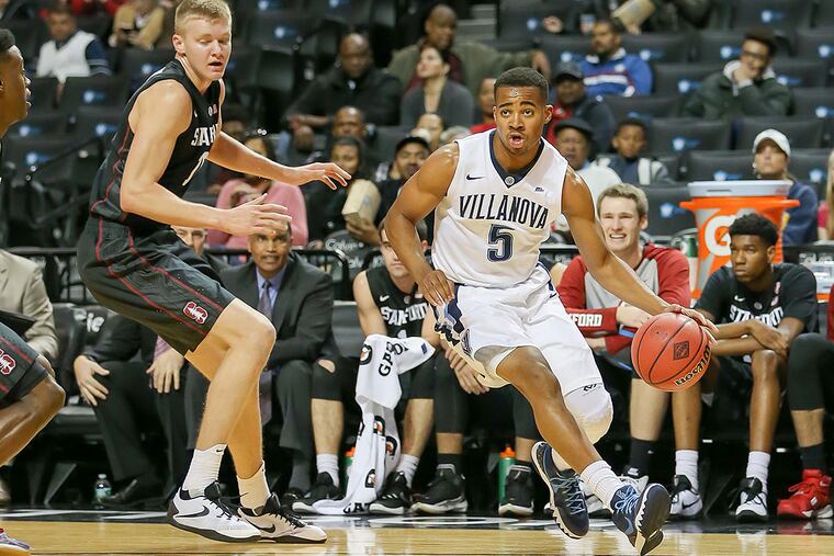 Villanova Wildcats guard Phil Booth (5) dribbles to the basket in his game against the Stanford Cardinal at Barclays Center.