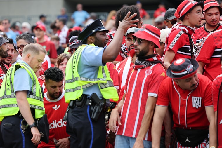 Philadelphia police try to rein in the Wydad fans in the Club World Cup Group G match against Manchester City at Lincoln Financial Field in Philadelphia on Wednesday, June 18, 2025. Funding for police overtime is in jeopardy as federal security funding is tied up in debates over immigration enforcement.