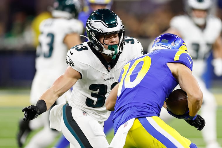 Eagles cornerback Cooper DeJean goes after Los Angeles Rams wide receiver Cooper Kupp earlier this season.