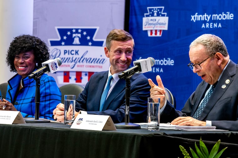 Mayor Cherelle L. Parker anf David L. Cohen are joined by DNC Chair Ken Martin (center) after he and the committee's technical team toured the Xfinity Mobile Arena facilities Thursday as the city makes its bid to host the 2028 Democratic National Convention.