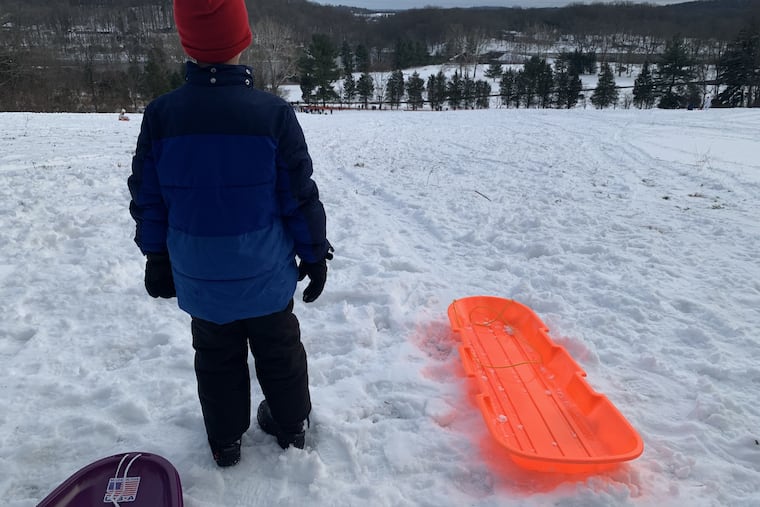 Getting ready to tackle a formidable sledding hill at Green Lane Park in Montgomery County, Pa., on Dec. 7, 2020.