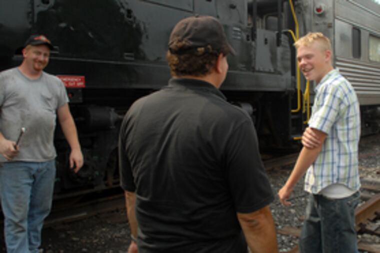 At Tuckahoe station (from left): technician Mike Schreiber, railroad president Tony Macrie, and rail enthusiast Tom Rinck.