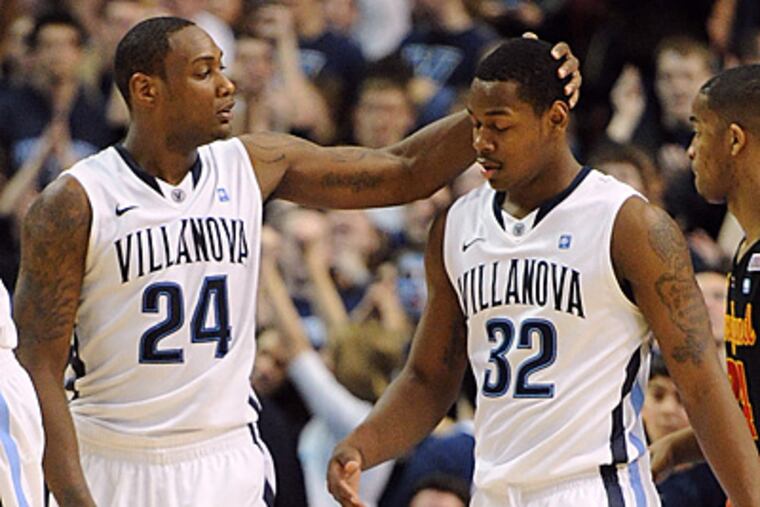 Villanova guards Corey Stokes and James Bell celebrate after defeating Maryland, 74-66. (AP Photo/Barbara Johnston)