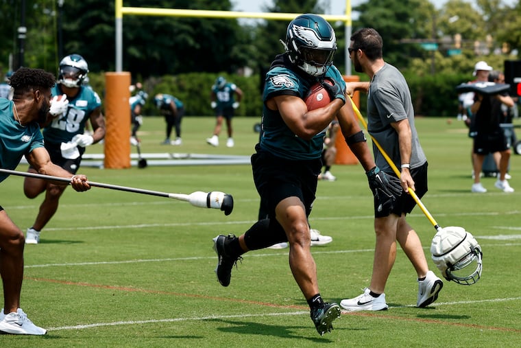 Eagles running back Saquon Barkley runs through a drill during OTAs last week.