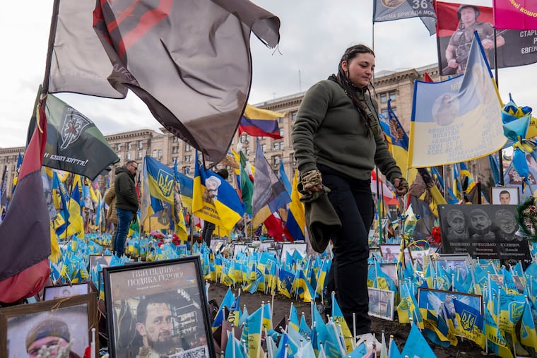People look at the memorial to the fallen Ukrainian soldiers on Independence Square in Kyiv, Ukraine, March 4, 2025.