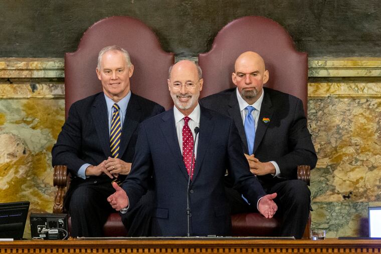 Pennsylvania Gov. Tom Wolf delivers his 2020-21 budget address in the state House of Representatives as Speaker Mike Turzai, left, and Lt. Gov. John Fetterman, right, look on, on Feb. 4, 2020, in Harrisburg, Pa.