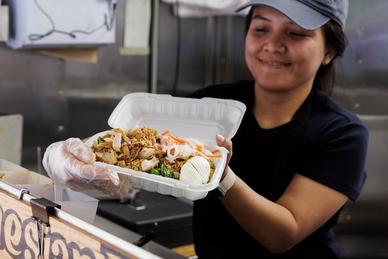 Rea Juweta prepares Sego Goreng Jowo at the Sego food cart near 16th and Market Streets on Wednesday, Sept. 3, 2025 in Philadelphia.