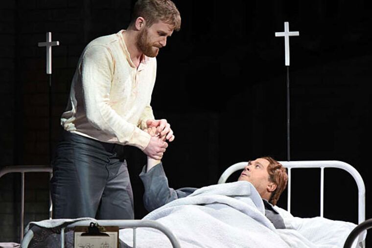 Oscar (David Daniels) befriends several infirmary patients (including a man portrayed by Jarrett Ott). (Opera Philadelphia | Photo by Kelly & Massa)