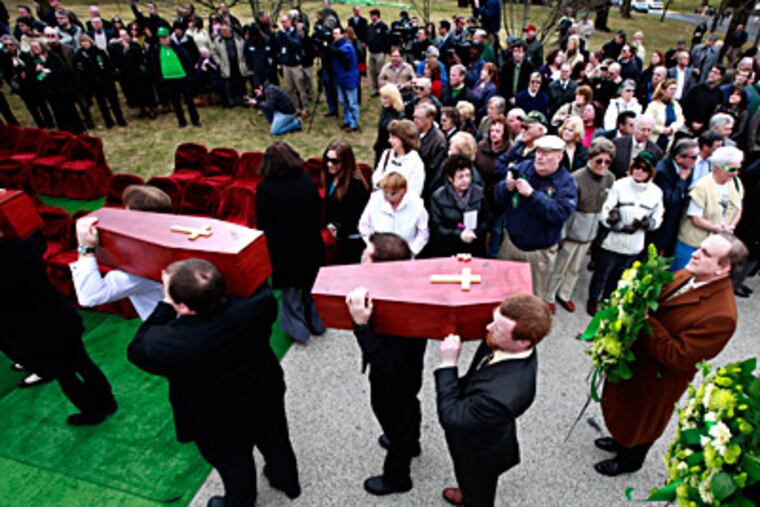 The remains of the Duffy's Cut workers are given a Christian burial at West Laurel Hill Cemetery. They were among 57 Irish immigrants buried in a mass grave in Chester County, dead from disease and possibly murder, say researchers. (David Swanson / Staff Photographer)