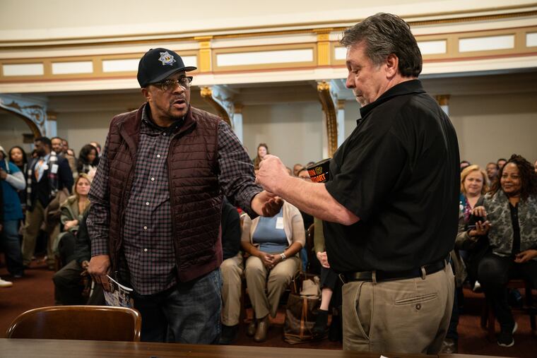 Jewell Williams draws for ballot position out of the coffee can in room 676 of City Hall, in Philadelphia, Wednesday March 20, 2019.