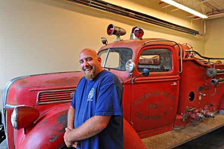 Franklin Fire Co. # 1, in Mansfield Twp, NJ, is raising money to restore a 72-year-old truck the volunteer company recently obtained on Craigslist. Here, Barry Rasmussen, vp of the fundraising committee with the 1941 truck on on July 23, 2013. ( APRIL SAUL / Staff )