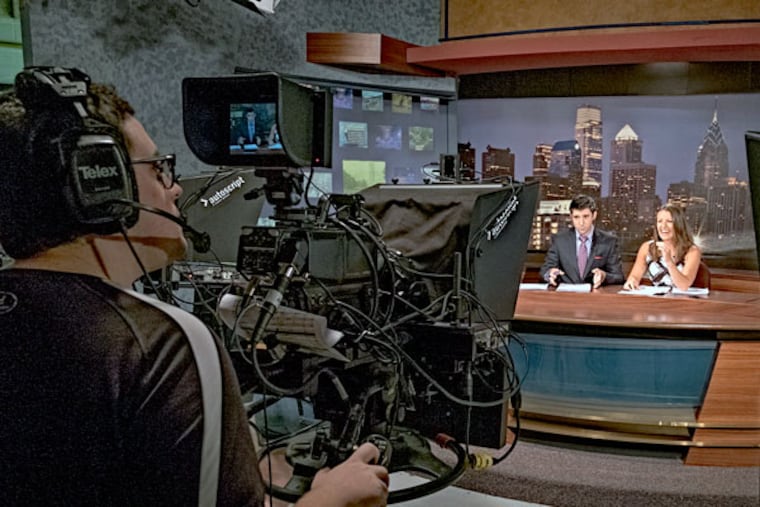 Anchors Phil Dupont and Beccah Hendrickson deliver the news for Temple University's student television station. (ED HILLE/Staff Photographer)