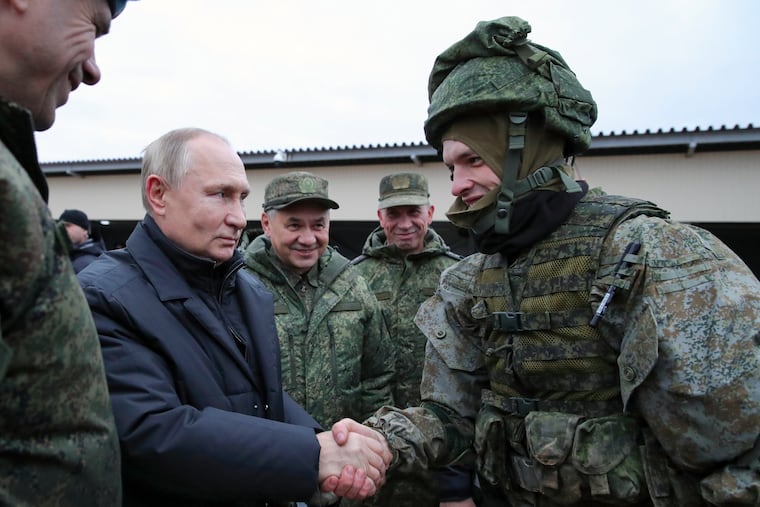 Russian President Vladimir Putin shook hands with a soldier as he visited a military training center of the Western Military District for mobilized reservists on Oct. 20.