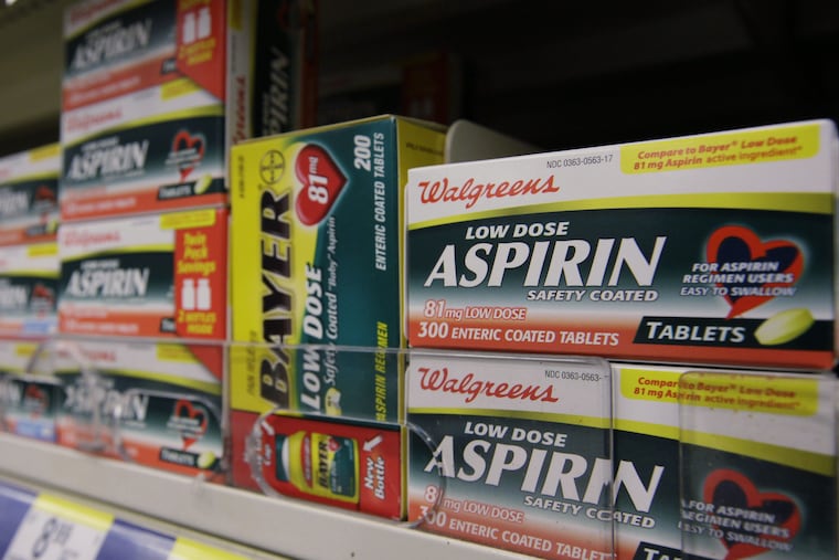 Packages of aspirin fill the shelves of a drugstore, Tuesday, Aug. 11, 2009 in Chicago.