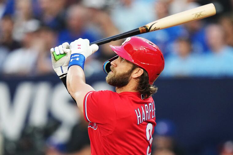 Bryce Harper watches his solo home run against the Toronto Blue Jays during the third inning.