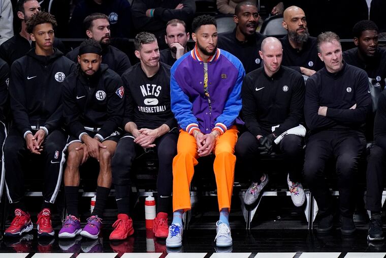 Ben Simmons (center) recently spoke about his trade from the Sixers to the Nets.