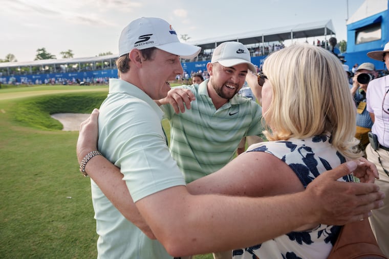 Matt Fitzpatrick (left) hugs his mother Susan (right) after his team with brother Alex (center) won the PGA Zurich Classic of New Orleans tournament.