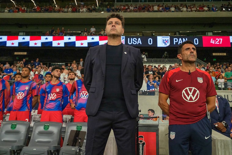 Mauricio Pochettino (center) and his top assistant Jesús Pérez (right) on the U.S. bench during the national anthems before Saturday's game.