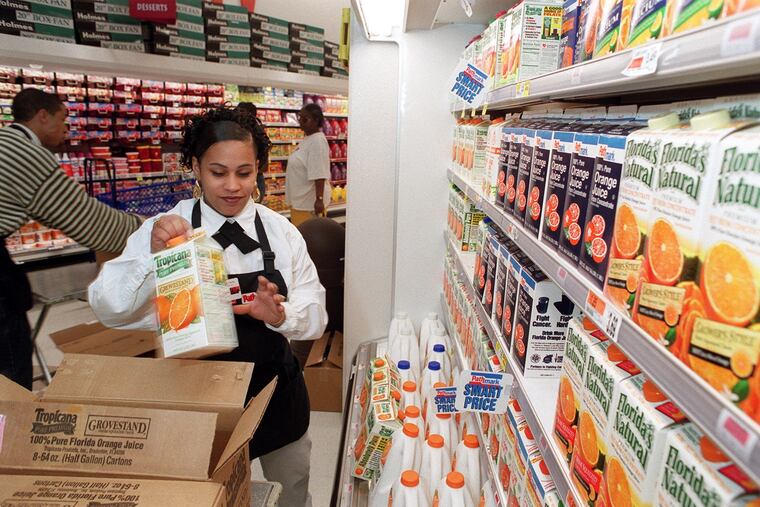 Rosa Padilla stocking shelves at what was then a new Pathmark in North Philadelphia in 1999.