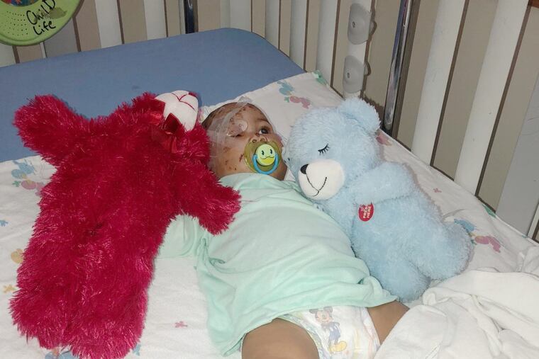 Journi Black Rodgers, 4 months, was photographed by her father, Sam Black, at St. Christophers Hospital for Children on Christmas Eve.