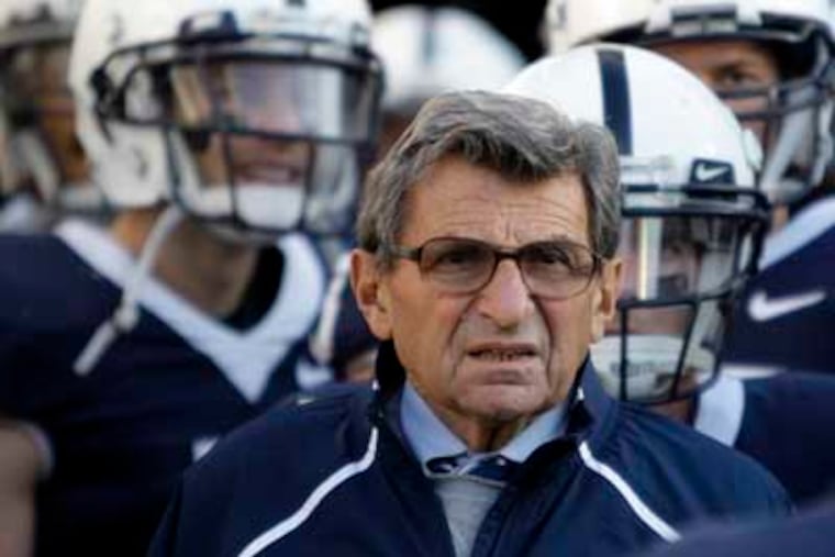 In this Nov. 7, 2009, file photo, Penn State Coach Joe Paterno stands with his players before taking the field for an NCAA college football game against Ohio State in State College, Pa. Paterno and other senior Penn State officials "concealed critical facts" about Jerry Sandusky's child abuse because they were worried about bad publicity, according to an internal investigation into the scandal released Thursday, July 12, 2012. (AP Photo/Carolyn Kaster, File)