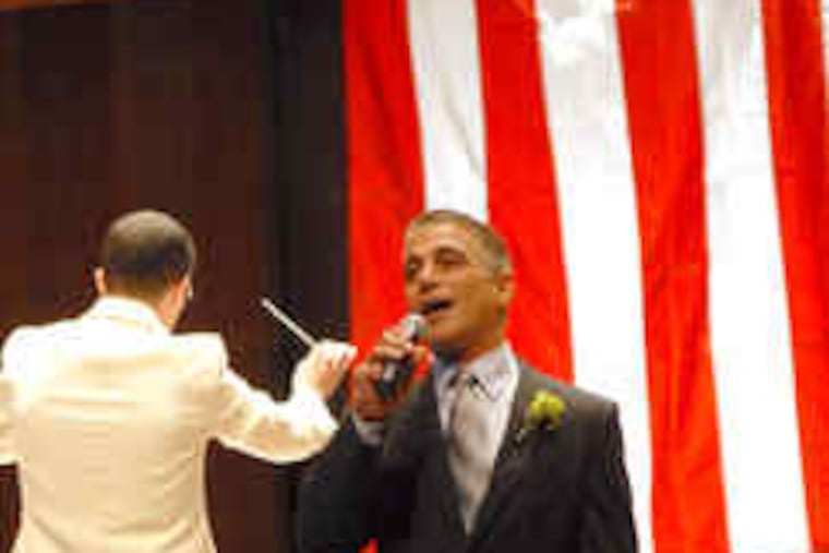 At the Fallen Heroes Tribute Concert at the Mann, a salute to Philadelphia police, emcee Tony Danza sings with the Philadelphia Orchestra. The benefit last night raised $160,000 for the survivors fund of the Fraternal Order of Police. The event, attended by about 1,200, was a mix of music and speeches - including one by Mayor Nutter, who paid tribute to officers killed on duty.