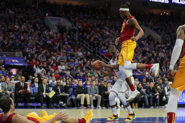 Jimmy Butler faking a shot to get Pacers defender Myles Turner in the air during Sunday's game at the Wells Fargo Center.
