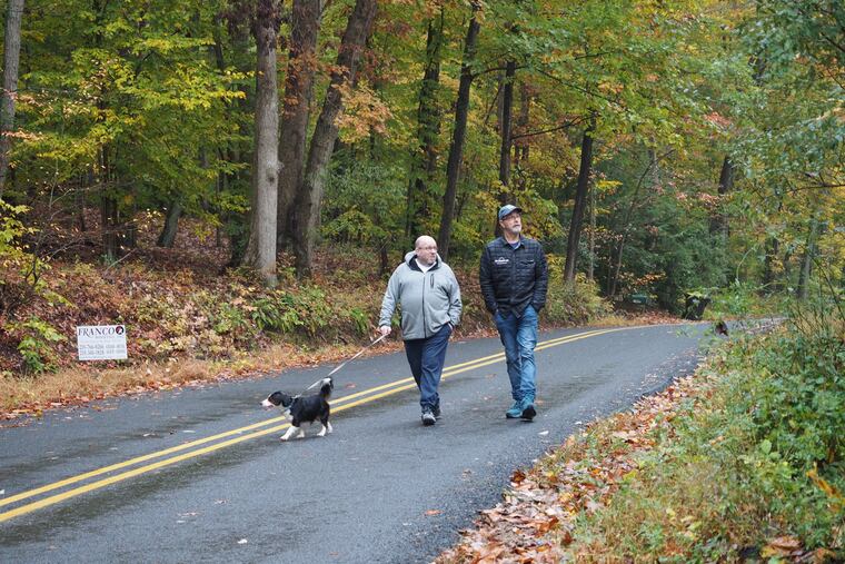 Phil Gutis (left) with his husband, Tim Weaver.