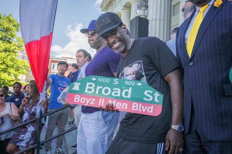 Boyz II Men band member Shawn Stockman shows off a new street sign proclaiming part of Broad Street “Boyz II Men Blvd.”