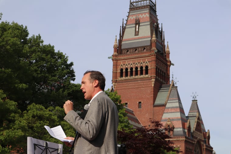 Ryan Enos, a government professor at Harvard University, speaks at a protest against President Donald Trump's recent sanctions against the school on Tuesday, May 27, 2025, in Cambridge, Mass.
