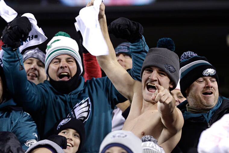 Eagles fans cheer during the first half of an NFL wild-card playoff football game against the New Orleans Saints, Saturday, Jan. 4, 2014, in Philadelphia. (Julio Cortez/AP)