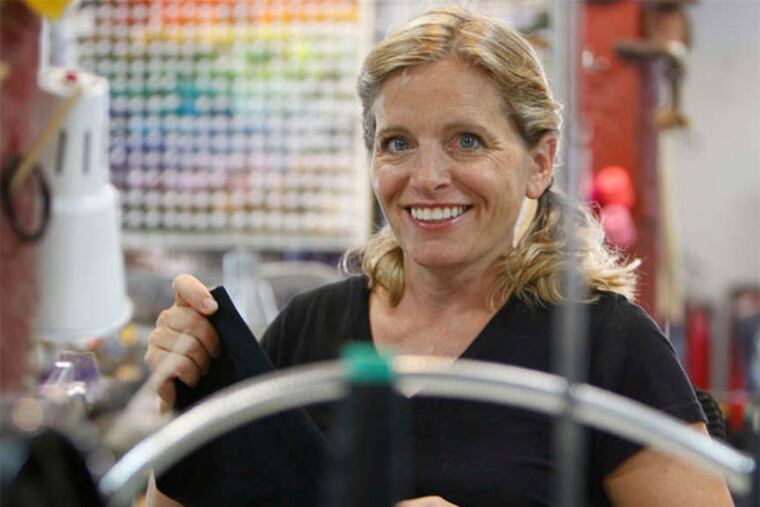 Maryanne Petrus-Gilbert is the owner of Sardine Clothing Co., a Roxborough fashion firm that repurposes old T-shirts into colorful skirts. (David Maialetti / Staff Photographer)