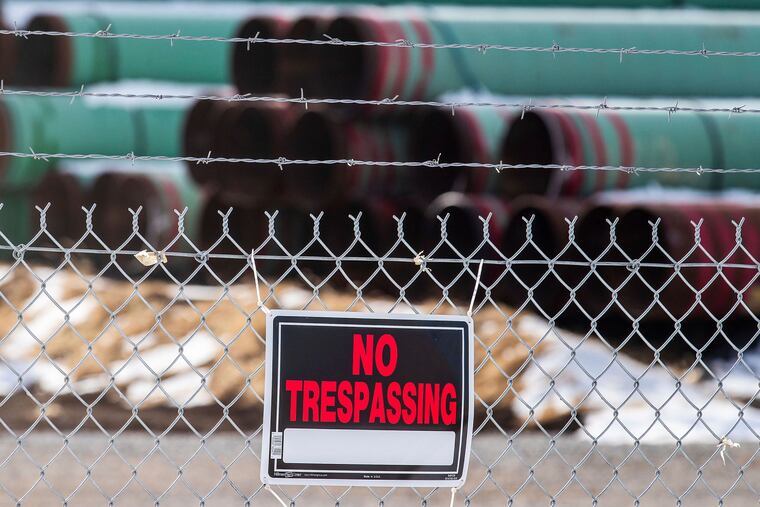 Pipes that were to be used for the Keystone XL pipeline are stored in a field near Dorchester, Neb.