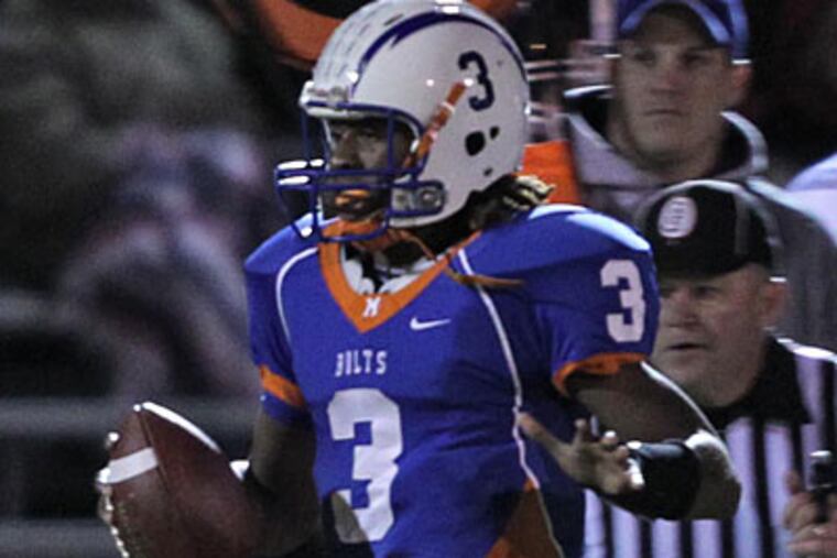 Millville quarterback Shaquille Lee passed for a touchdown and a two-point conversion. (David M Warren/Staff Photographer)